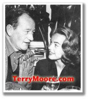 Terry Moore and John Wayne (autographed photo)