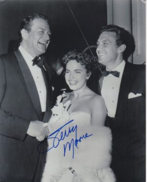 Terry Moore with John Wayne and Robert Stack